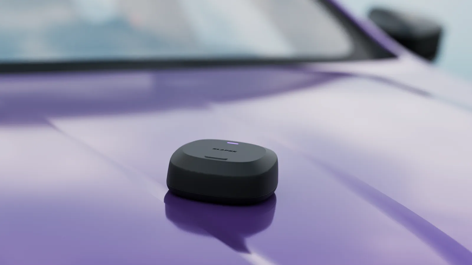 Elapse on the bonnet of a purple car, out in the open.